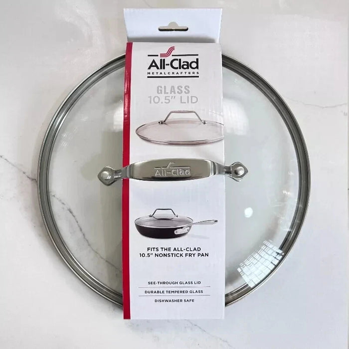 All-Clad 10.5 inch glass lid with stainless steel rim shown fitting a hard anodized skillet