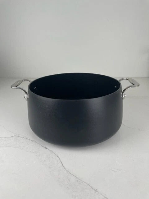 All-Clad HA1 hard anodized nonstick 8 quart stock pot shown without lid, minor cosmetic bend on exterior