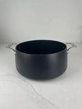 All-Clad HA1 hard anodized nonstick 8 quart stock pot shown without lid, minor cosmetic bend on exterior