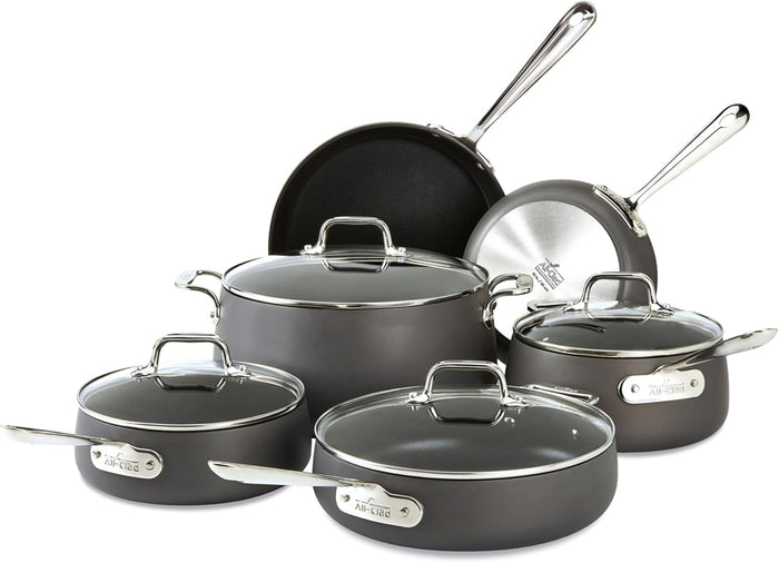 All-Clad HA1 10-piece hard anodized nonstick cookware set including pots, pans, and lids on white background