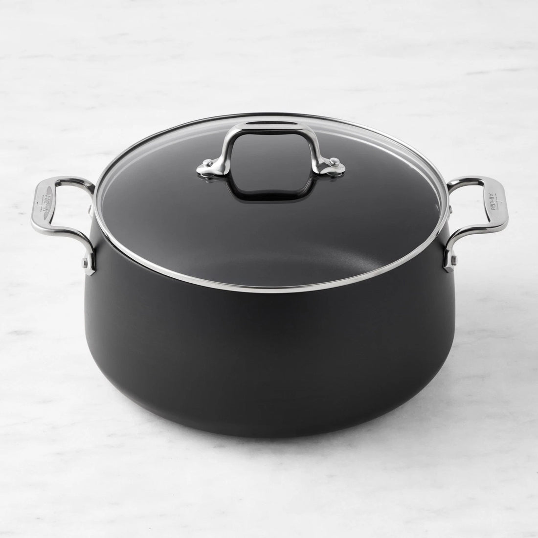 All-Clad HA1 6 quart hard anodized nonstick stock pot with tempered glass lid on white background
