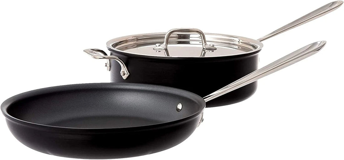 All-Clad NS1 hard anodized nonstick 4-quart saute pan with lid and 10-inch fry pan on white background