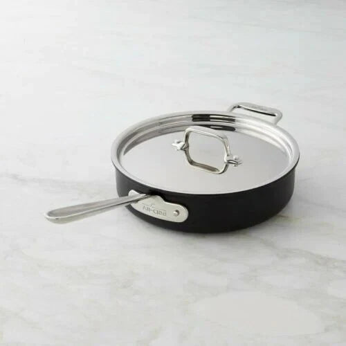 All-Clad NS1 Hard Anodized Nonstick 4-qt Saute Pan shown with tempered glass lid on white background