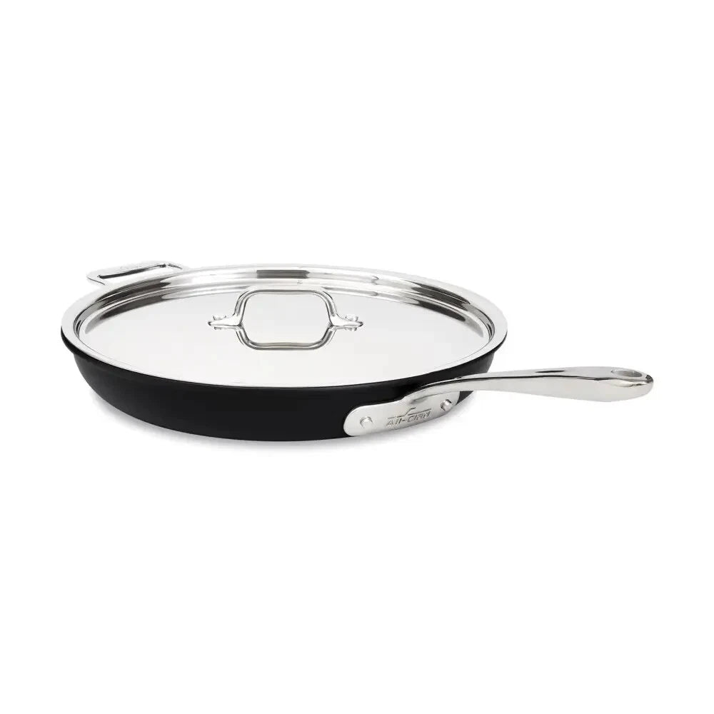 All-Clad NS1 Pro Nonstick 12 inch fry pan shown with tempered glass lid on white background